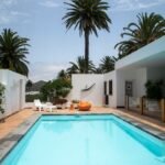 a swimming pool with palm trees