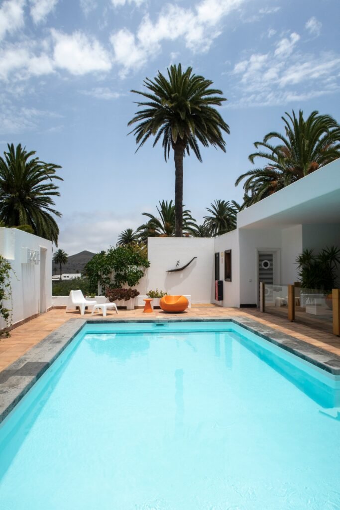 a swimming pool with palm trees